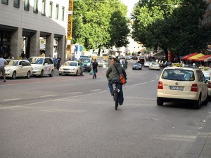 20090829172716-de-munich-city-cyclist_with_attention-w
